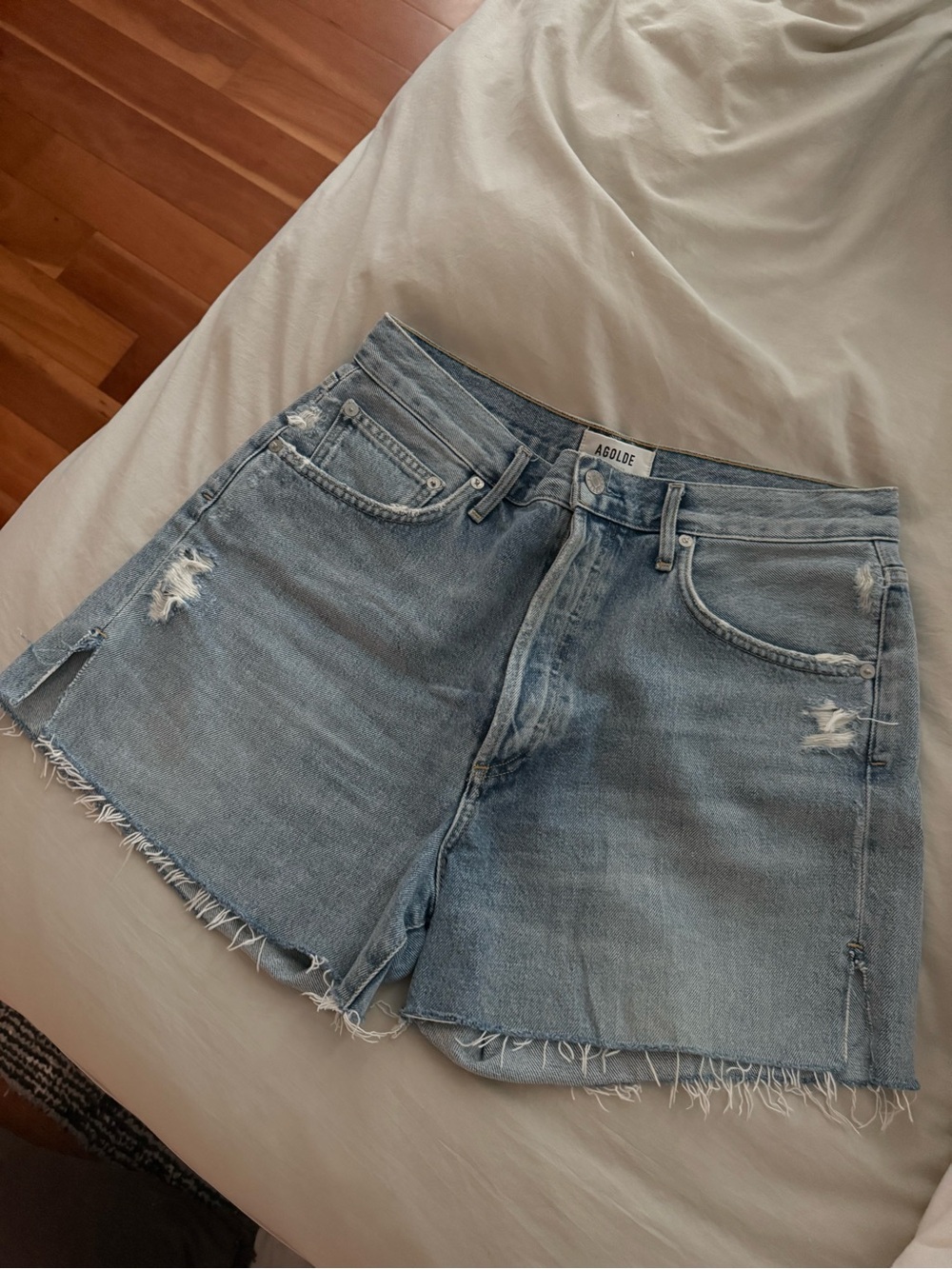 Agolde Faded Light Blue Distressed Denim Cutoff Shorts